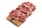 Raw pork sliced meat on wooden board on white background. Heap of pieces raw pork isolated on white background. Butchery, market,