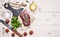 Raw pork steak with rosemary, knife for meat, cherry tomatoes and parsley border ,place for text wooden rustic background top