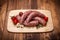 Raw pork thick sausages on cutting board