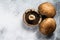 Raw Portobello mushrooms. Gray background.  Top view. Space for text