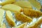 Raw potato wedges on a baking tray covered in foil