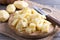 Raw potatoes, chopped cubes on a wooden board