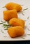 Raw potatoes croquettes and rosemary spice