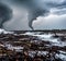 The raw power of a tornado by focusing on its twisting motion as it ravages the landscape