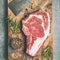 Raw prime beef meat steak rib-eye and chopping knife, flat-lay