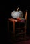 Raw pumpkin on rustic chair