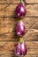 Raw purple Aubergine or eggplant. wooden background. Top view