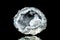 Raw quartz druse or geode mineral stone in front of black background