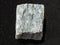 raw quartz-mica schist stone on dark background