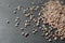 Raw radish seeds on grey background, closeup. Vegetable planting