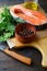 Raw Red Fish, parsley, rosemary and spice on a cutting board