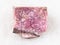 raw rhodonite stone on white