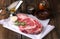 Raw ribeye steak marbled meat with salt, olive oil, rosemary and