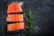 Raw salmon filet on dark slate background, wild atlantic fish, space for text