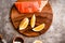 Raw salmon filet on gold board and gray slate background, wild atlantic fish.Omega3