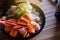 Raw salmon fillet with roe Ikura on dish in restaurant,Japanese Food,Close up