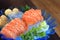 Raw salmon slice or salmon sashimi fresh serve on ice - Japanese food recipe.