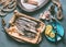 Raw sardines on kitchen table background with frying pan and ingredients for tasty seafood cooking