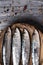 Raw sardines on a rustic wooden table