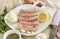 Raw sausages, pork sausages on a plate, spices