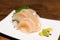 Raw scallop sashimi or hotate sashimi served with wasabi on dish, Japanese famous delicious raw seafood meal. Asian food