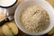 Raw scottish oatmeal, milk in a mug and apple