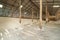 Raw sea salt heap inside traditional local wooden storage barn. Nature material in salt industry factory