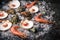 Raw seafood: scallops, langoustines, shrimps and oysters