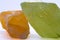 Raw shiny semi-transparent vibrant orange and pistachio lime green calcite crystals