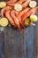 Raw shrimp, garlic, lime, curry and sea salt on a dark wooden background