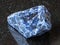 Raw Sodalite gemstone on black granite