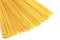 Raw spaghetti, yellow pasta isolated on white