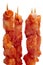 Raw spanish pinchos morunos, spiced chicken meat skewers