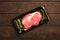 Raw steak in an airtight packaging