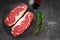 Raw striploin beef steak with rosemary