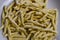 Raw strozzapreti, specialties from northern Italy, fresh twisted pasta that cooks very quickly and is suitable for chunky sauces