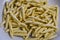 Raw strozzapreti, specialties from northern Italy, fresh twisted pasta that cooks very quickly and is suitable for chunky sauces