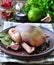 Raw stuffed pigeon with lime, garlic, parsley, sea salt and pepper