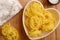 Raw tagliatelle in a heart shaped bowl