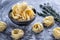 Raw tagliatelle nido on the flour-dusted black wooden background