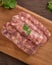 Raw Taiwanese sausage in garlic flavor in a plate on wooden table background