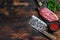 Raw Top Blade beef meat steak. Dark wooden background. Top view. Copy space