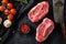 Raw  top blade flat Iron beef cut organic meat ner butcher meat clever knife for bbw or gtrill over black stone background top