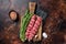 Raw traditional shish kebab Skewers with beef meat ans spices. Dark background. Top view