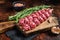 Raw traditional shish kebab Skewers with beef meat ans spices. Dark background. Top view