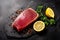 Raw tuna fillet on a black stone top view with parsley, lemon and spice. Generative AI