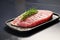 raw tuna steak with seared edges on a ceramic plate