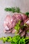 raw turkey or chicken fillets meat on grey cutting board with dill