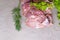 raw turkey or chicken fillets meat on grey cutting board with dill