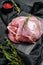 Raw Turkey thigh fillet. Farm eco meat. Dark  background. Top view